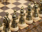 Luxury handcrafted chess set with storage and a full set of bronze metal chess pieces displayed.