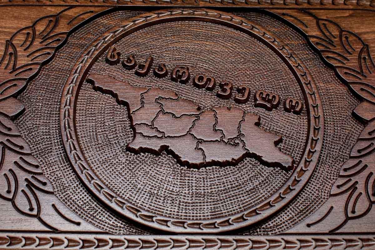 The backgammon board opened to show the wooden playing surface