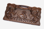 Carved beechwood backgammon board with a striding lion and scrollwork, propped open