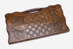 Angled view of the striding lion carved backgammon board