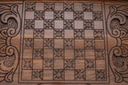The backgammon board opened to show the wooden playing surface