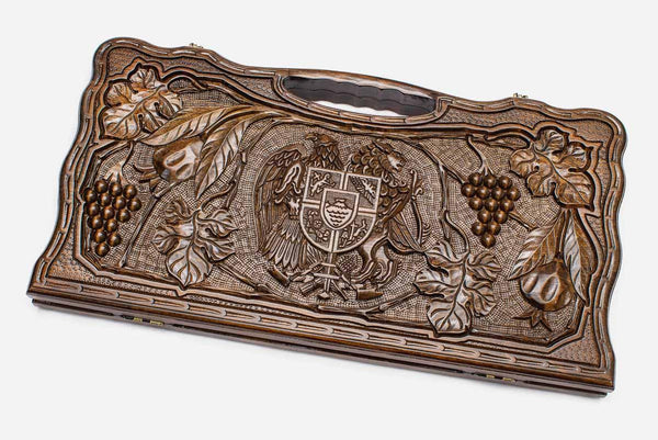 Carved beechwood backgammon board with the Armenian coat of arms and grapevines, propped open