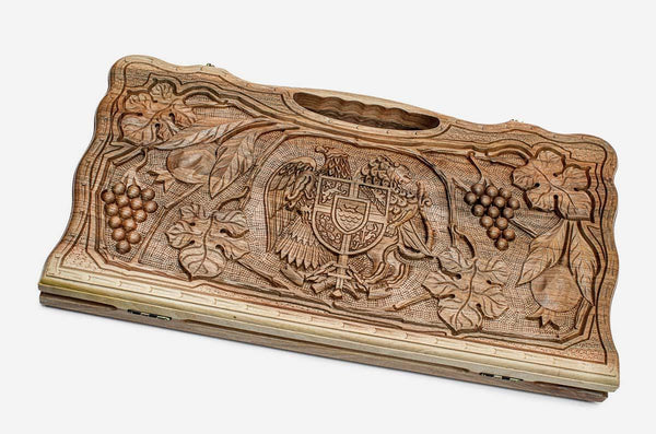 Carved walnut backgammon board with the Armenian coat of arms and grapevines, propped open
