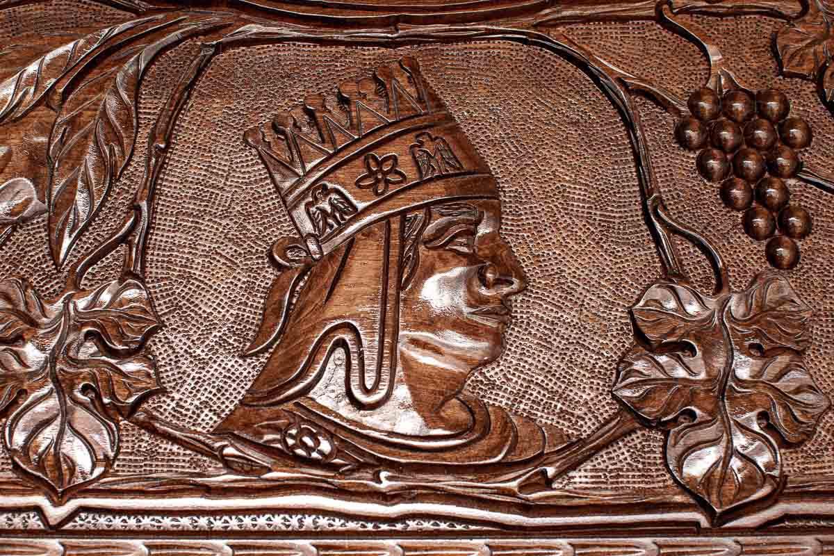 The backgammon board opened to show the wooden playing surface