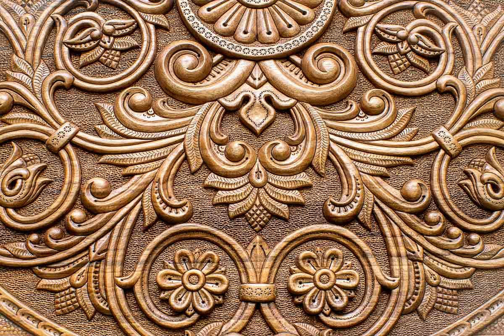 Angled view of the world master carved walnut backgammon board