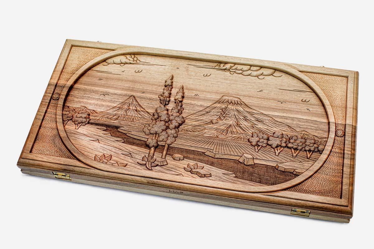 Master-carved walnut backgammon board with an oval-framed Mount Ararat landscape, propped open