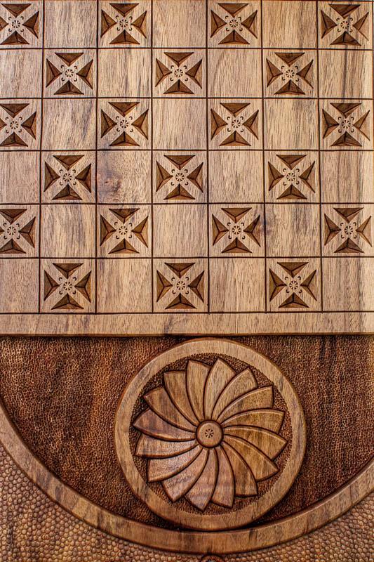 The backgammon board opened to show the wooden playing surface