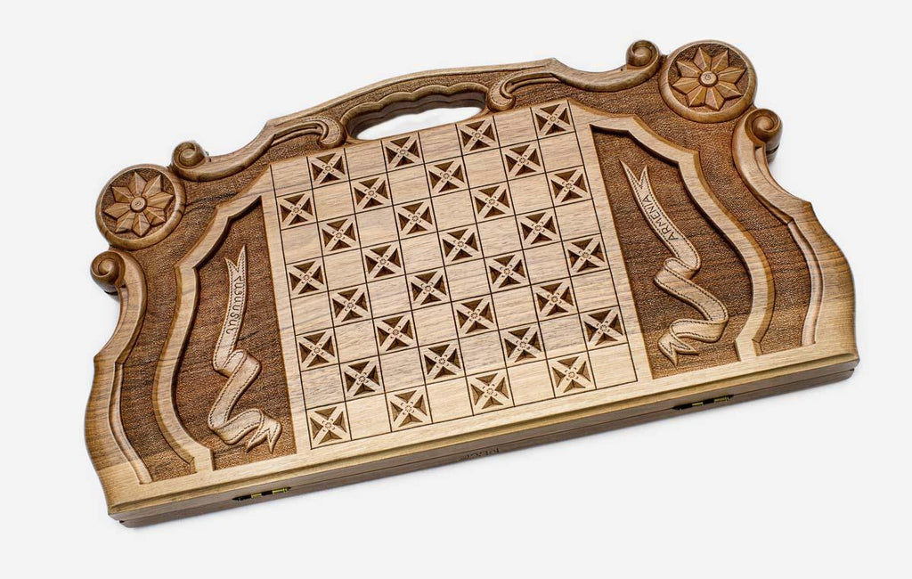 Angled view of the ornate Mount Ararat master walnut backgammon board