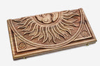 Angled view of the sun master carved walnut backgammon board