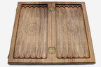 The backgammon board opened to show the wooden playing surface