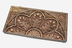 Master-carved walnut backgammon board with a pomegranate ornament, propped open