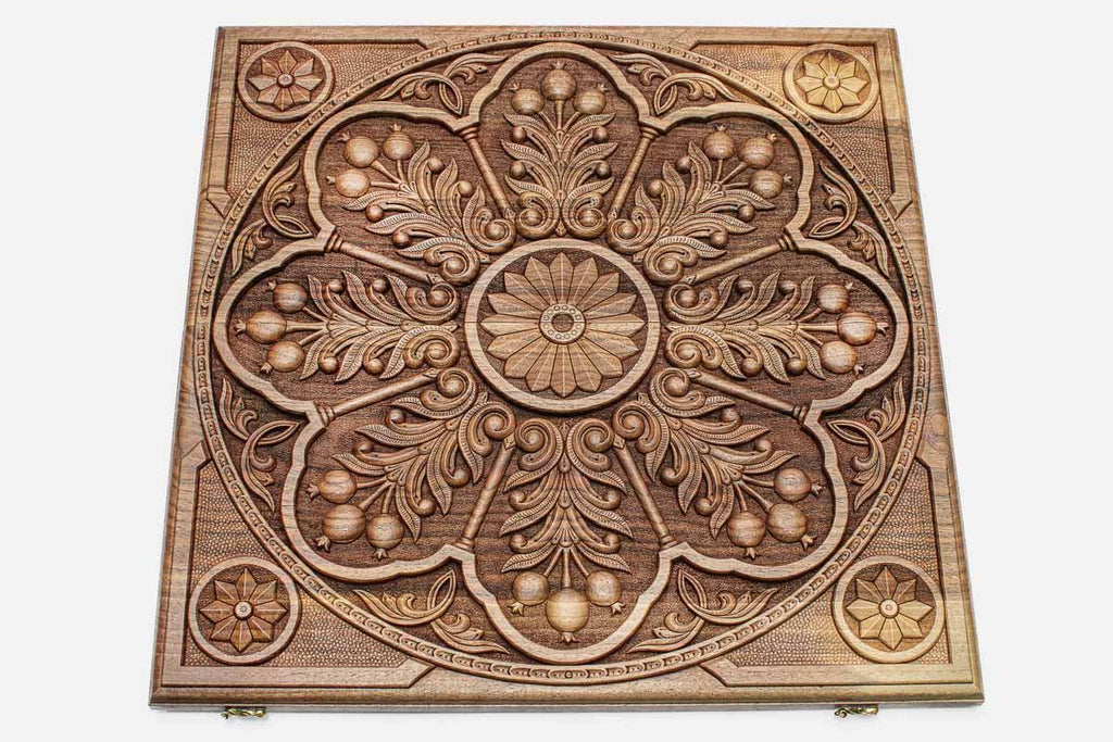 Angled view of the pomegranate ornament master walnut backgammon board