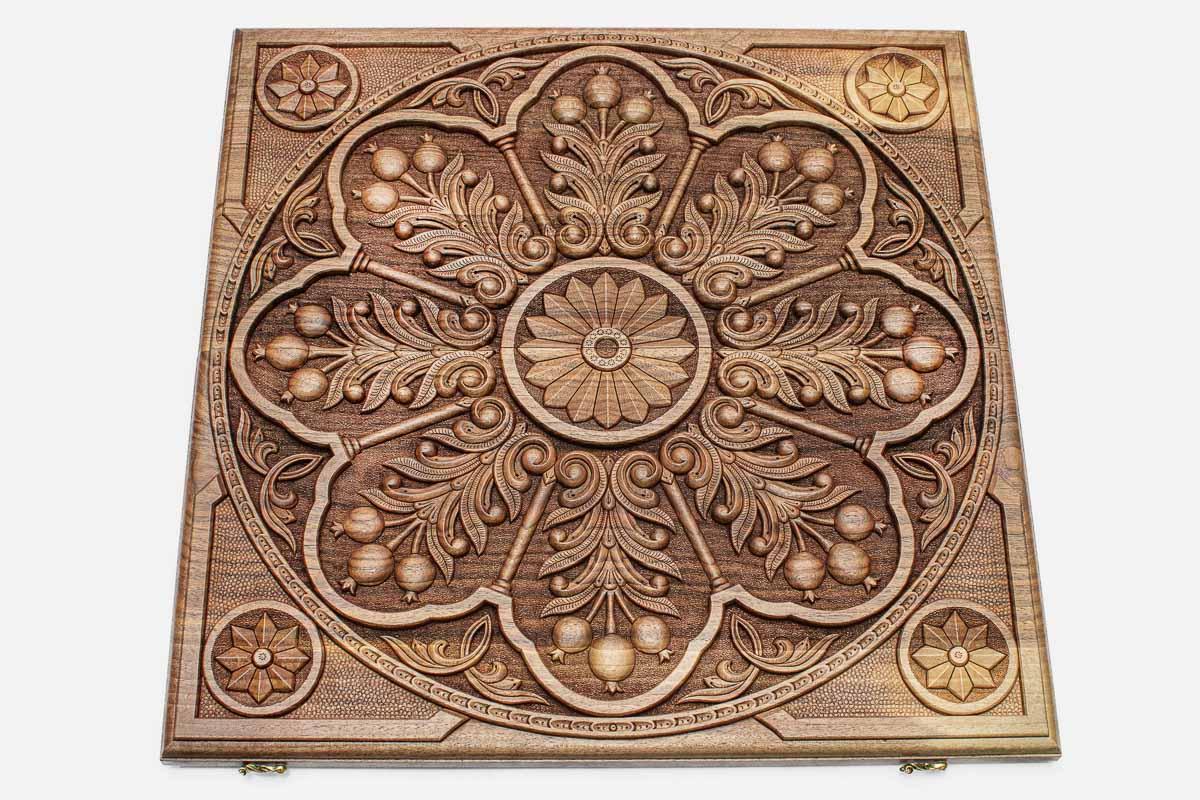 Angled view of the pomegranate ornament master walnut backgammon board