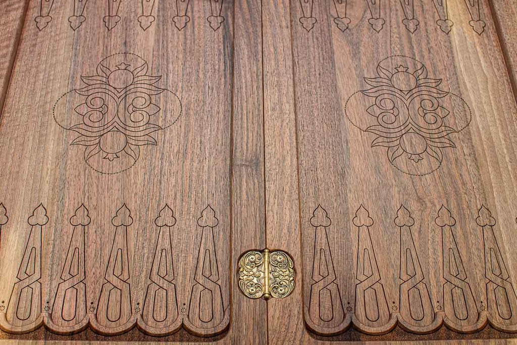The backgammon board opened to show the wooden playing surface