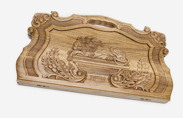 Master-carved walnut backgammon board with a royal lion and laurels, propped open