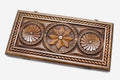 Master-carved walnut backgammon board with an octagon and infinity pattern, propped open