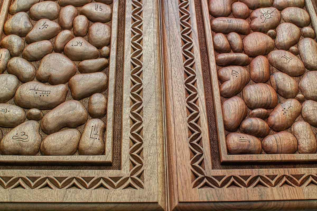 The backgammon board opened to show the wooden playing surface