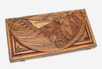 Angled view of the cherub master carved walnut backgammon board