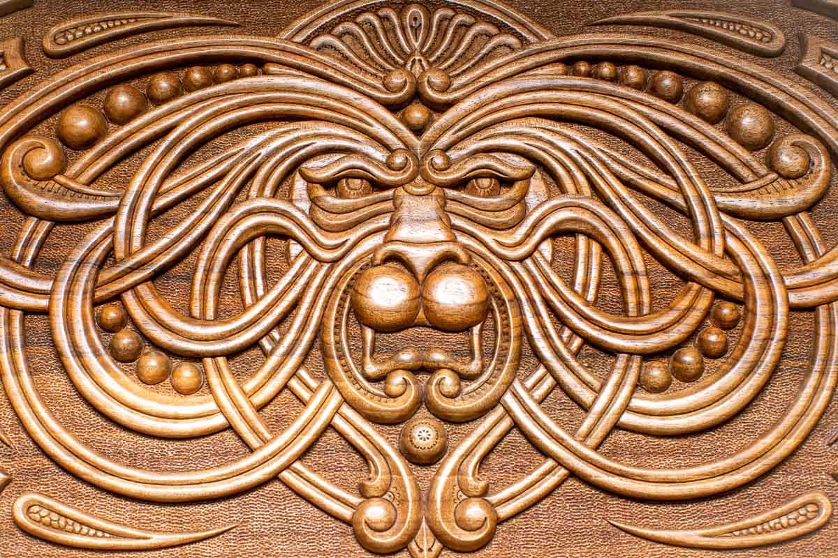 The backgammon board opened to show the wooden playing surface