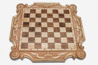 Angled view of the royal crown chess set with its bronze-topped wooden pieces