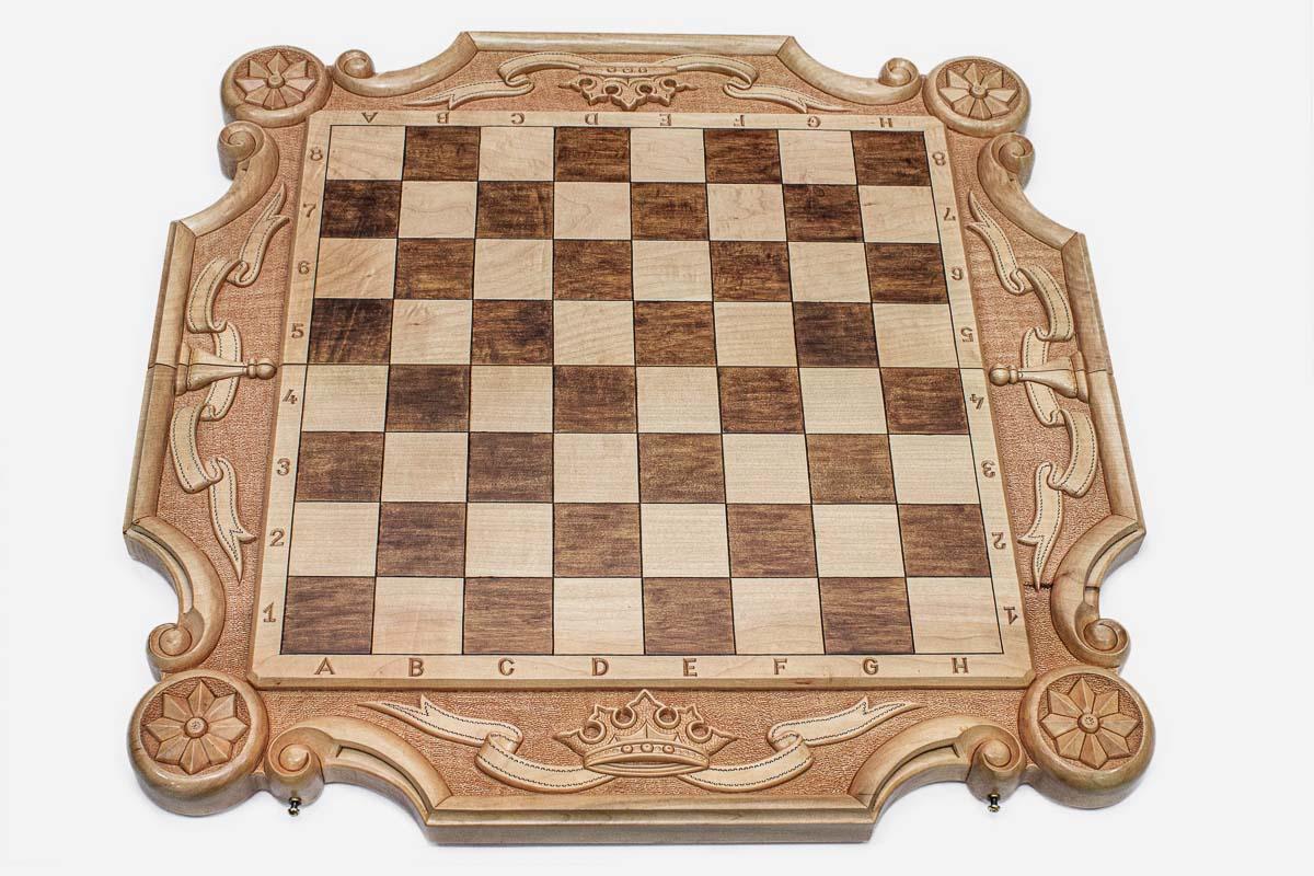 Angled view of the royal crown chess set with its bronze-topped wooden pieces