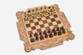 Luxury carved chess set in pale maple with corner ornament, ribbon scrollwork and a carved royal crown, set with bronze-topped pieces