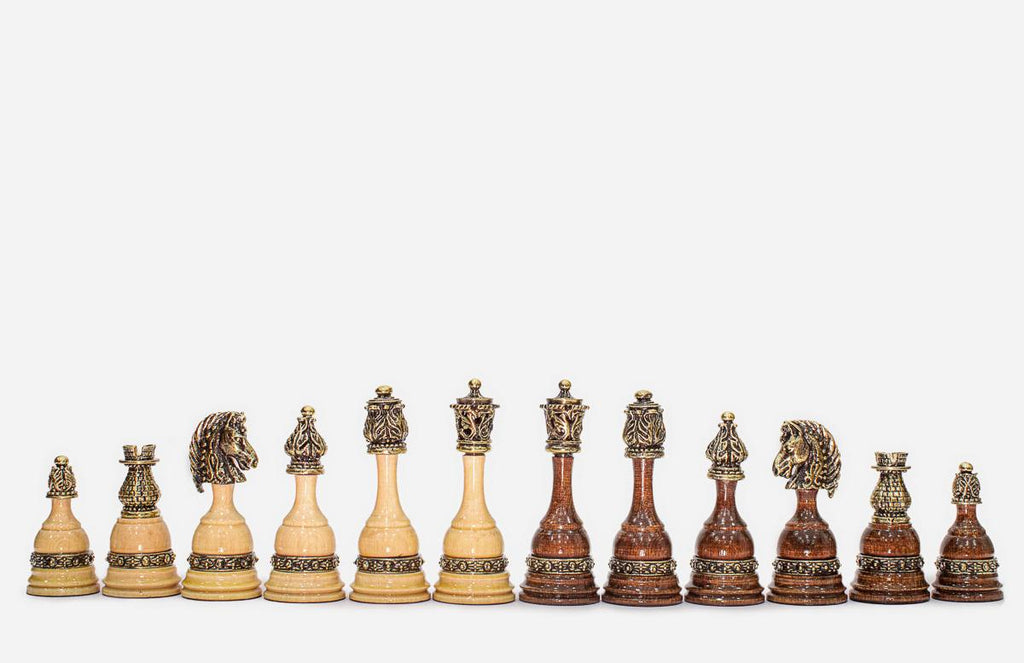 Angled view of the finished carved chess set showing the depth of the relief