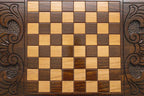 The backgammon board opened to show the wooden playing surface
