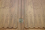 Hand-carved crowned detailing on a luxurious walnut board - angled view