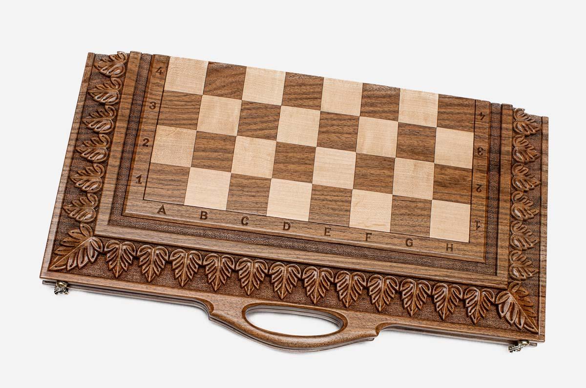 Figural bronze chess pieces on the luxurious walnut board - detail