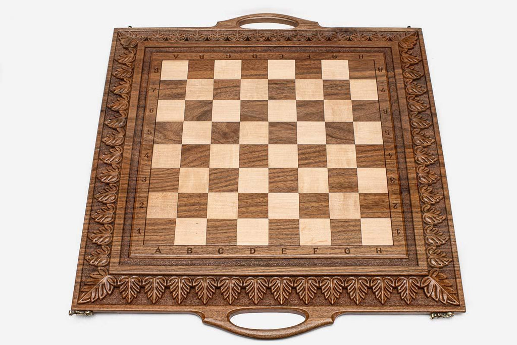 Master-carved ornate detailing on solid walnut - chess board close-up