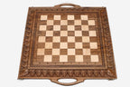 Master-carved ornate detailing on solid walnut - chess board close-up