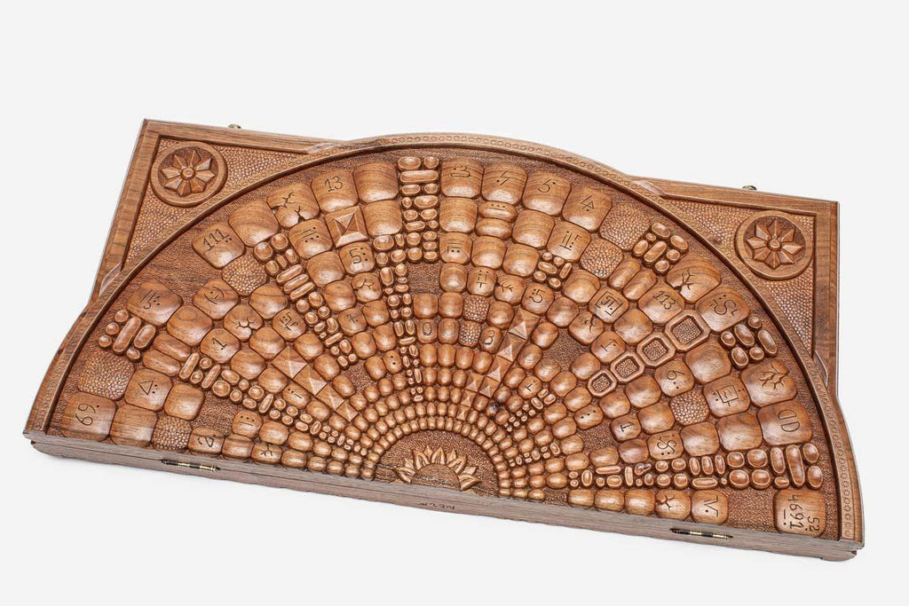 Master-carved walnut backgammon board with a celestial space design, propped open
