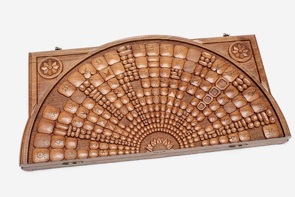 Angled view of the space master carved walnut backgammon board