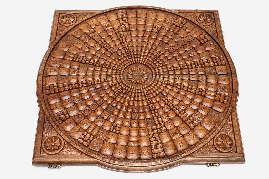 The backgammon board opened to show the wooden playing surface