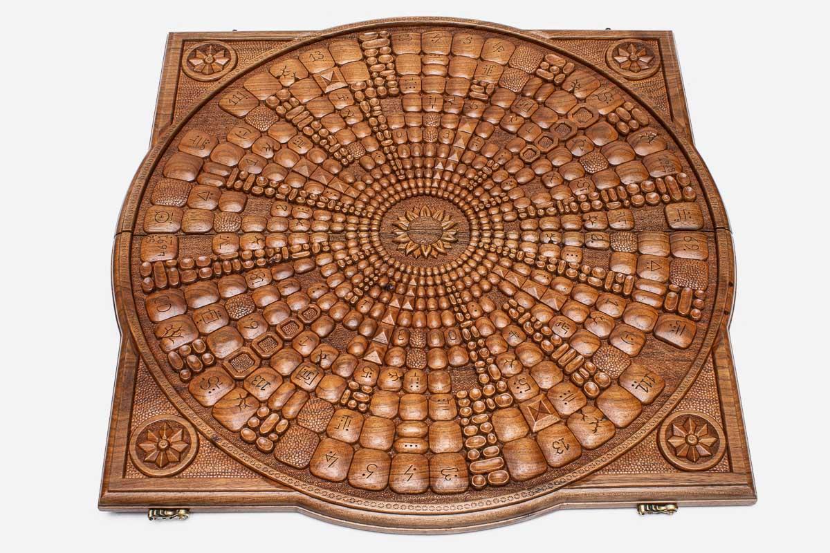 The backgammon board opened to show the wooden playing surface