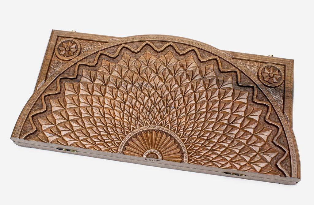 Master-carved walnut backgammon board with a deep-relief sunflower, propped open