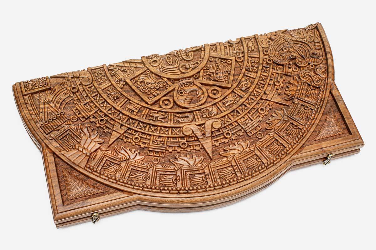 Angled view of the Maya calendar master carved walnut backgammon board