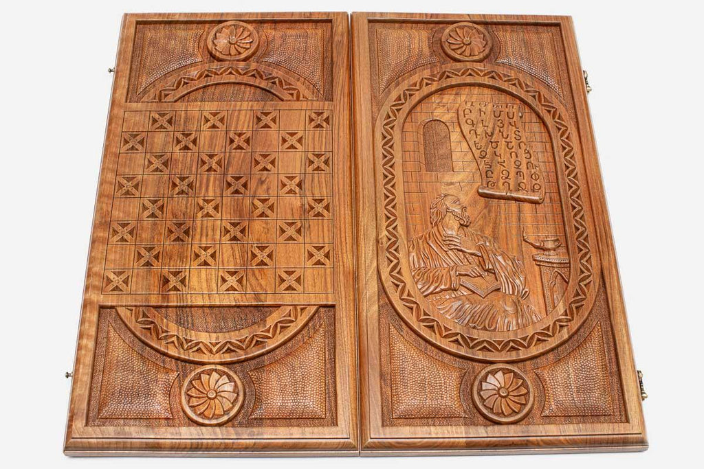 The backgammon board opened to show the wooden playing surface
