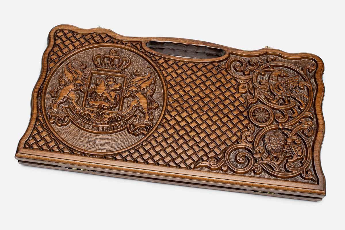 Carved beechwood backgammon board with the Georgian coat of arms and a carry handle, propped open