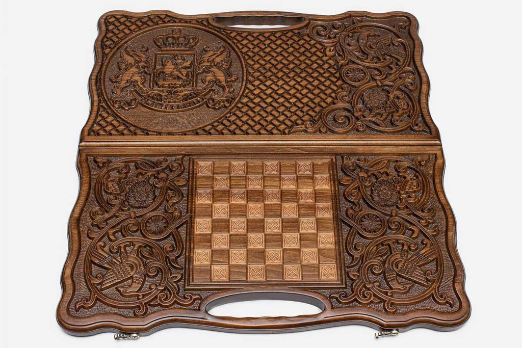The backgammon board opened to show the wooden playing surface
