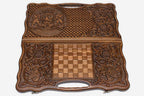 The backgammon board opened to show the wooden playing surface