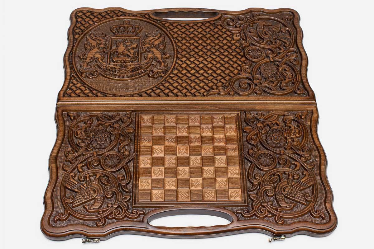 The backgammon board opened to show the wooden playing surface