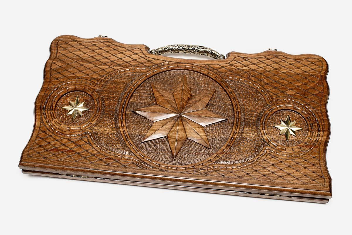 Carved beechwood backgammon board with an octagon ornament and ornate bronze handle, propped open