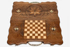 The backgammon board opened to show the wooden playing surface