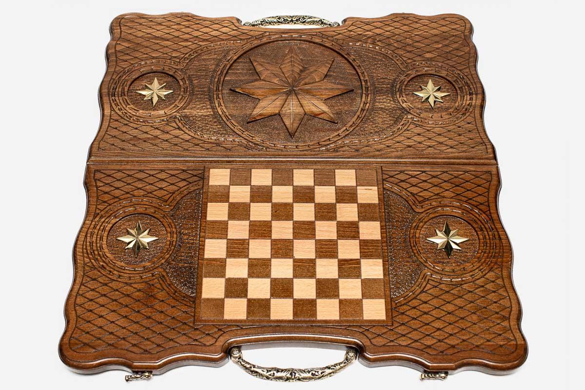 The backgammon board opened to show the wooden playing surface