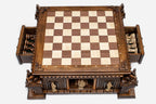 Fortress base with both storage drawers open revealing the carved figural chess pieces inside