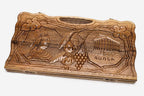 Carved walnut backgammon board with four carved scenes and a carry handle, propped open