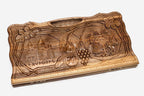 Angled view of the four scenes carved walnut backgammon board
