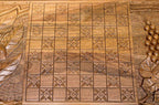 The backgammon board opened to show the wooden playing surface